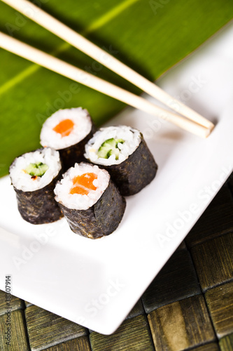 suhi rolls with chopsticks