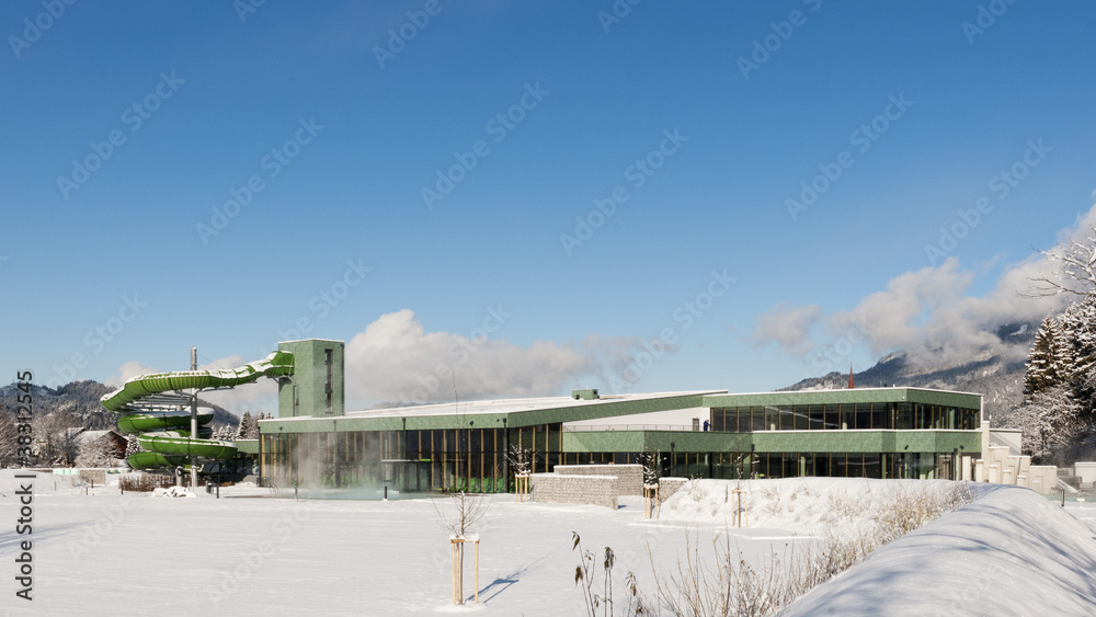huge swimming pool at a sunny day and blue sky in snowy nature huge swimming pool at a sunny day and blue sky in snowy nature