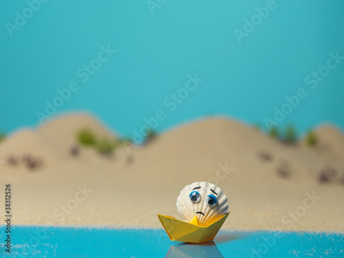 funny sad sea shell in miniature landscape