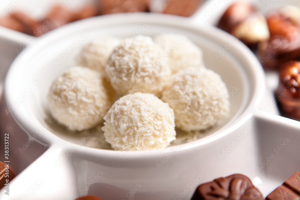 White coconut chocolate sweats on plate with White coconut chocolate sweats on plate with