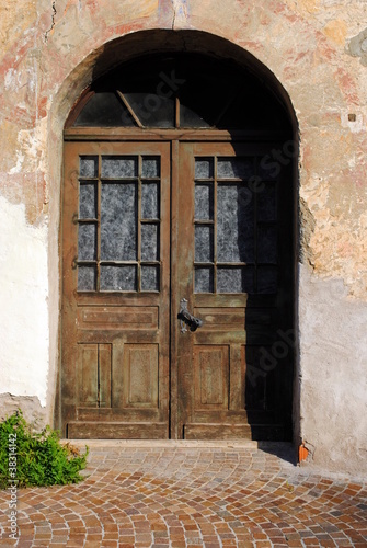 Old door made of wood  iron and glass