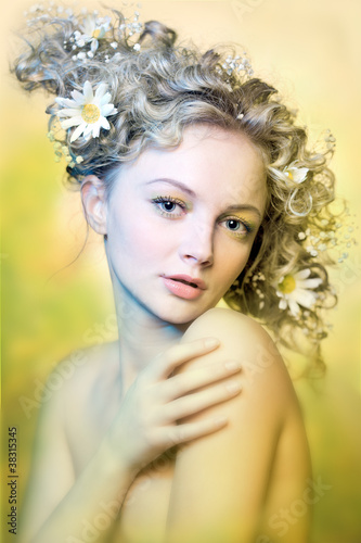 portrait of beautiful girl with flowers in their hair