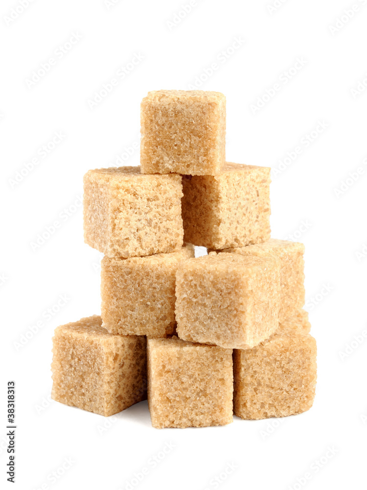 Pile of cane sugar cubes isolated on white background Pile of cane sugar cubes isolated on white background