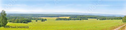 green field and blue sky