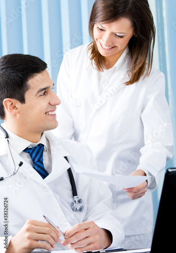 Two medical people working at office