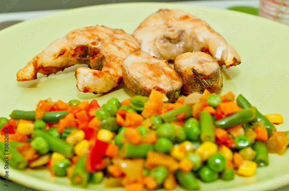 Closeup of Dinner Plate with Grilled White Fish and Vegetables Closeup of Dinner Plate with Grilled White Fish and Vegetables