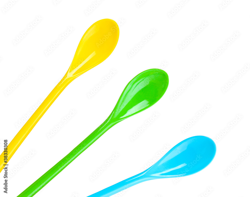 bright plastic spoons isolated on white