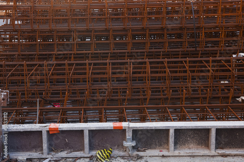 Steel rebars waiting to be used on a construction site.
