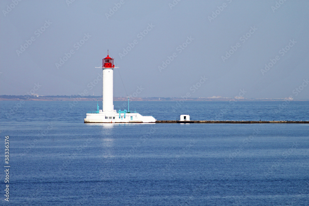 White lighthouse against the blue sky in Odessa, Ukraine