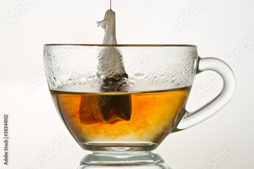 Make a hot tea isolated on white background