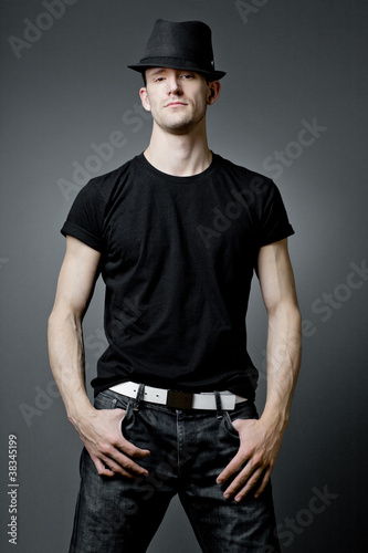 Handsome guy posing in black t-shirt.