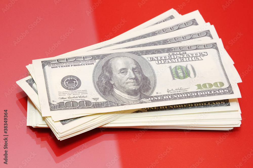 Dollars on red background Dollars on red background
