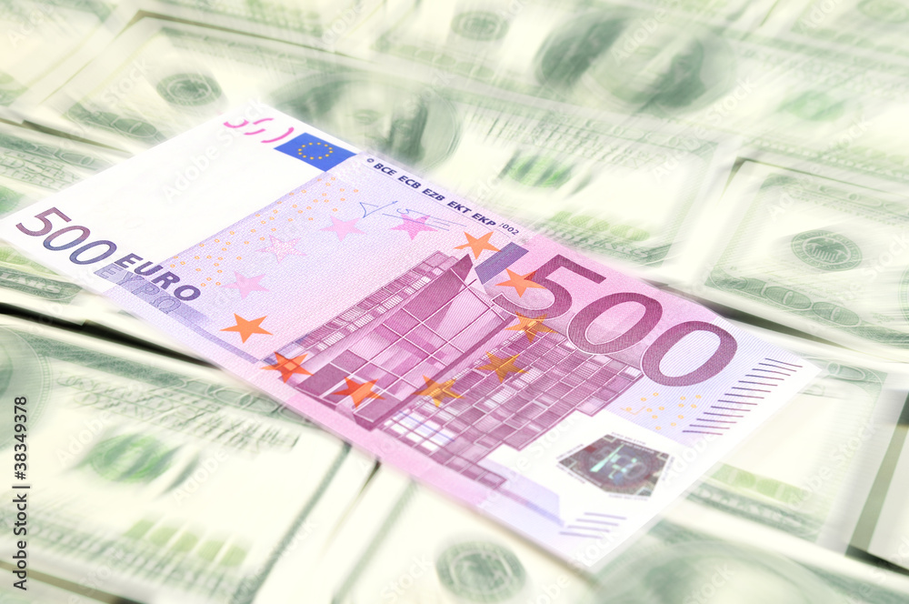 Euro banknote lying on the dollars background Euro banknote lying on the dollars background