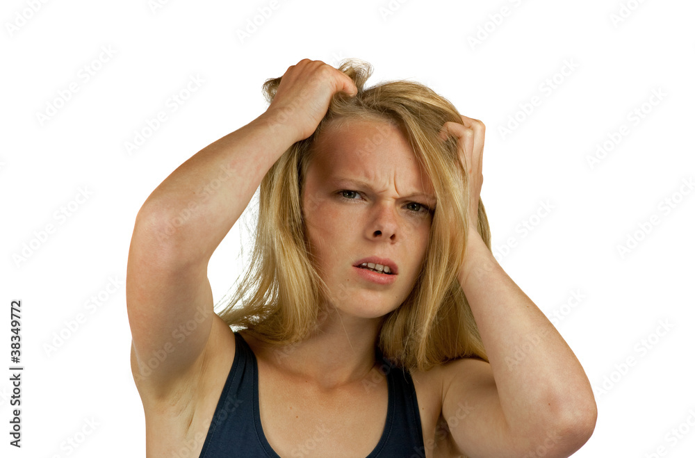 Young woman tearing her hair on white background