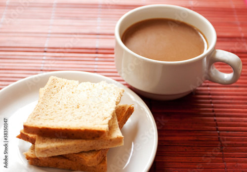 A cup of coffee and bread