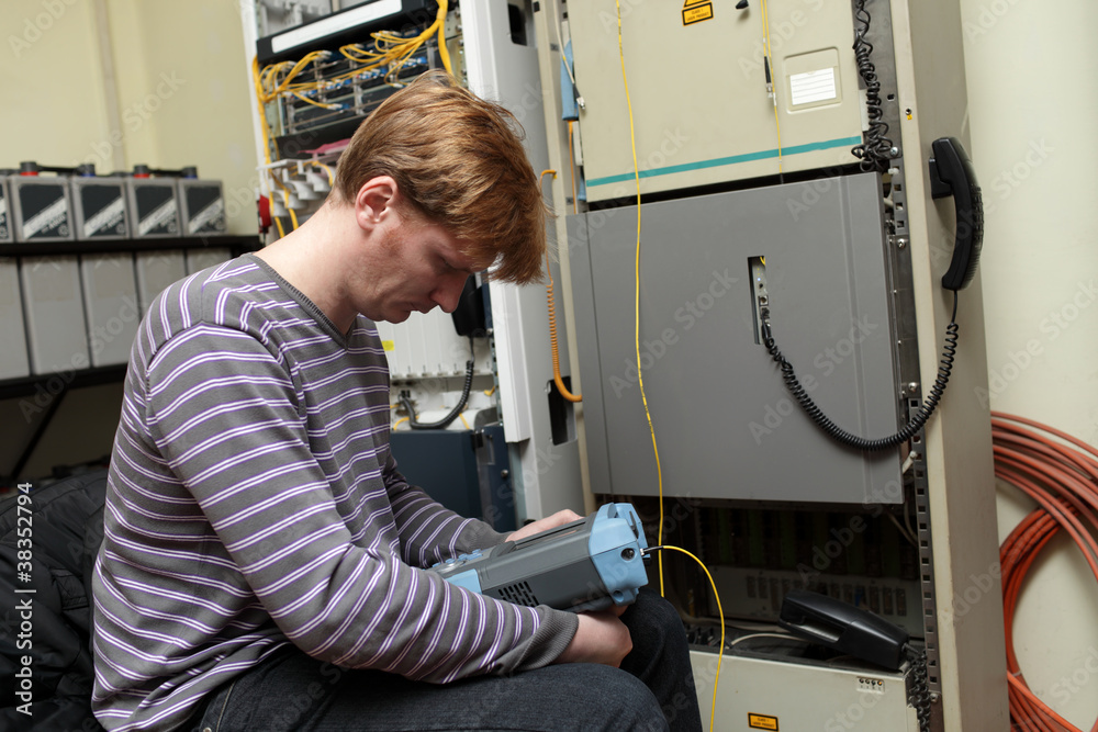 Technician with reflectometer Technician with reflectometer