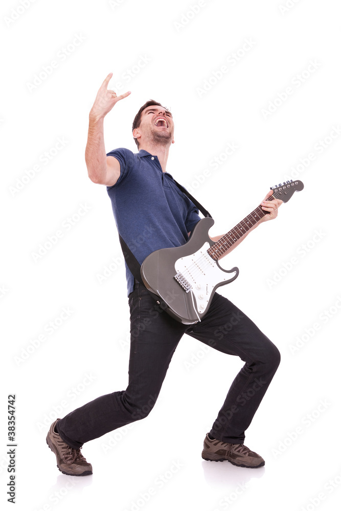 guitarist making a rock and roll gesture guitarist making a rock and roll gesture