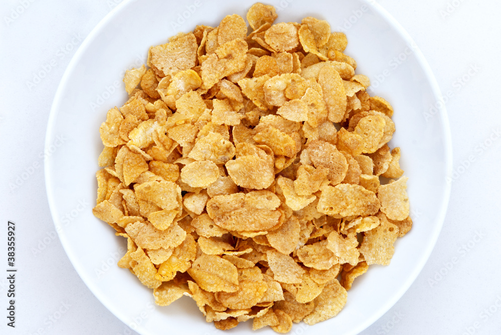Cornflakes in bowl on white background Cornflakes in bowl on white background