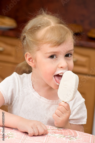 Cheerful girl eating ice cream