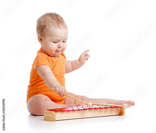 baby playing with musical toy