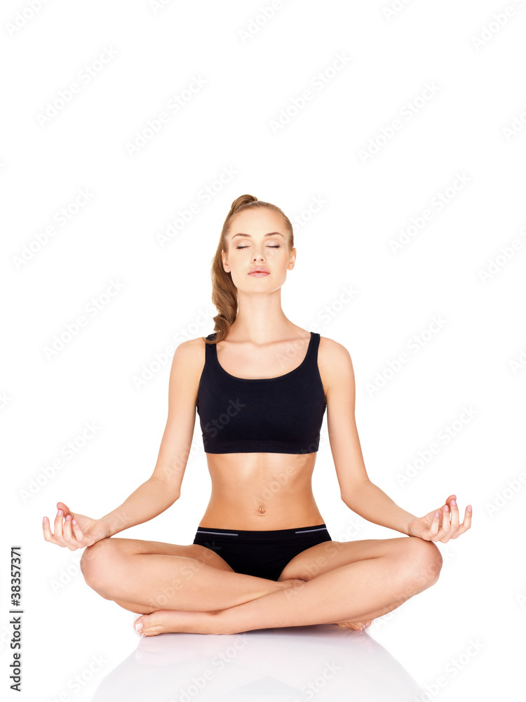 Portrait of pretty young woman doing yoga