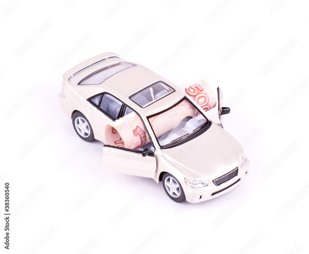 Folded banknote in the model car isolated Folded banknote in the model car isolated
