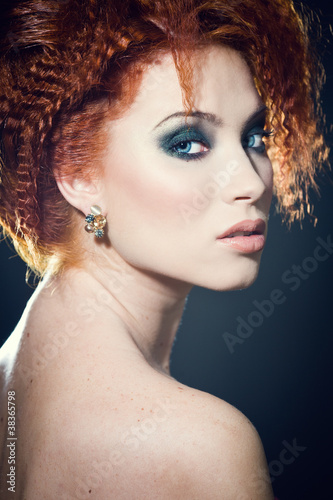 Face of a beautiful redhead woman with perfect makeup