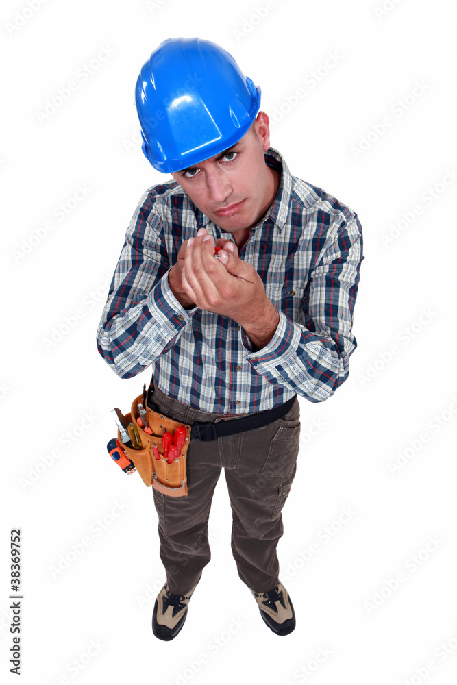 A handyman with a screwdriver. A handyman with a screwdriver.