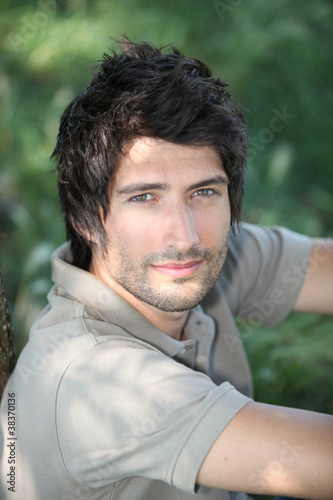 portrait of a young man in woods