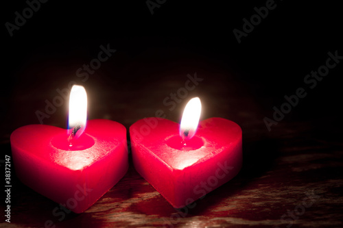 Red burning heart shaped candles