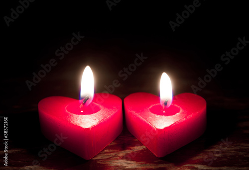 Red burning heart shaped candles