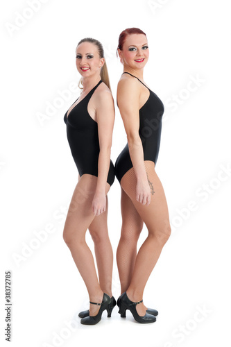 Two female dancers standing back to back