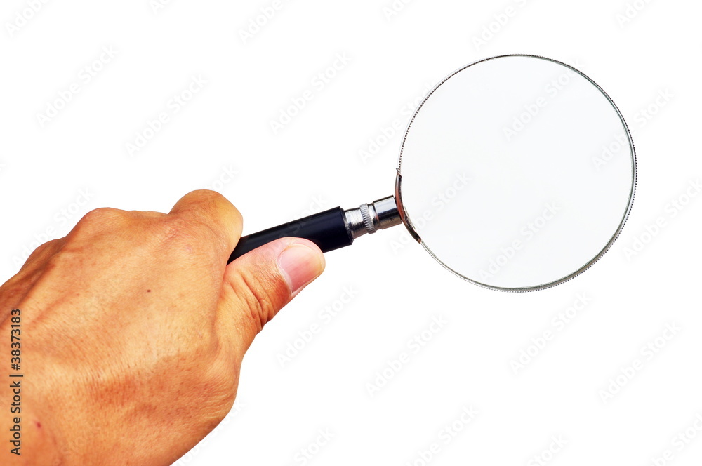 Magnifying glass in hand isolated on white background Magnifying glass in hand isolated on white background