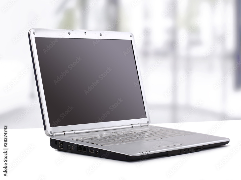 Laptop in the office on the table Laptop in the office on the table