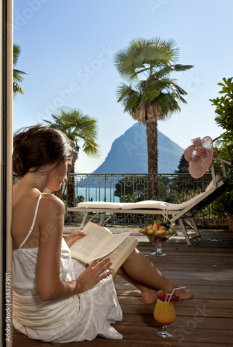 woman read a book on the terrace