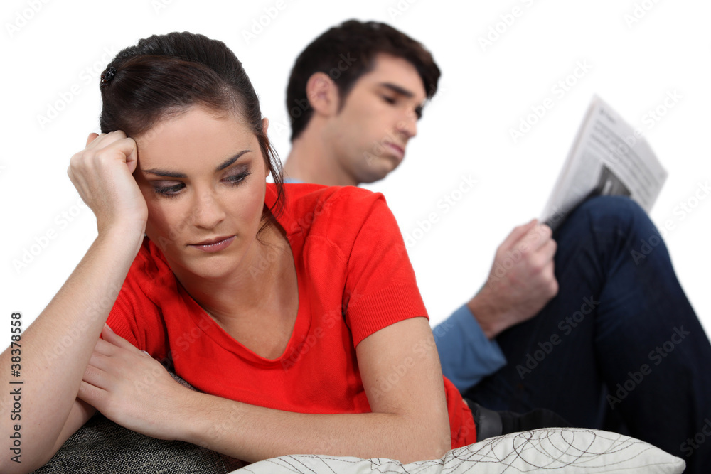 Bored couple sat at home
