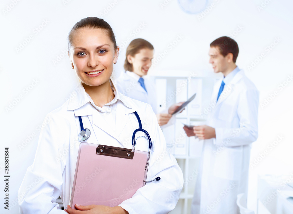 Friendly doctor in medical office Friendly doctor in medical office