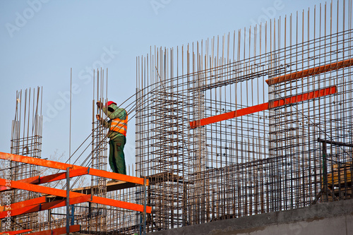 Worker prepearing concrete bars