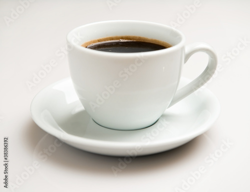Cup of coffee over white background