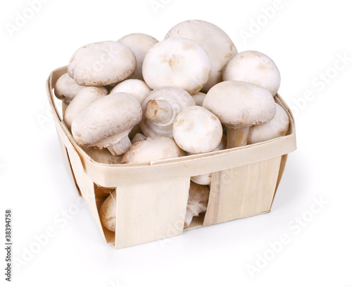 basket full of white mushrooms isolated on a white