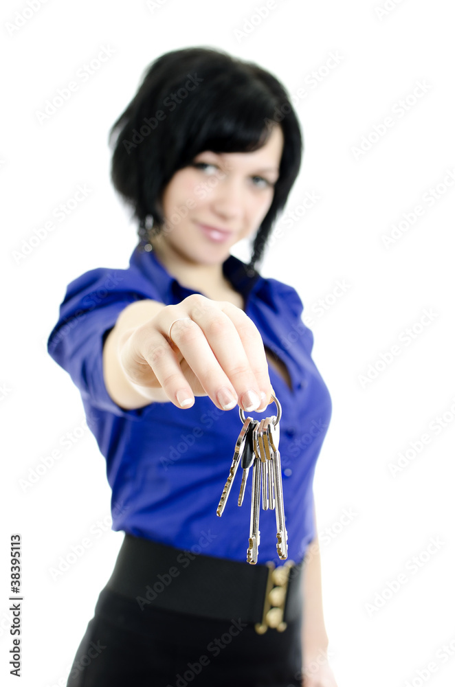 Business woman holding keys. Focused on keys. Business woman holding keys. Focused on keys.