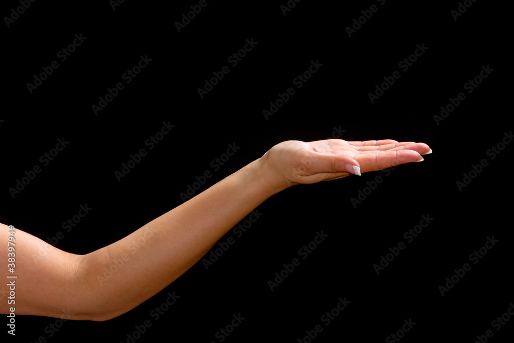 Female hand with open palm over black background Female hand with open palm over black background
