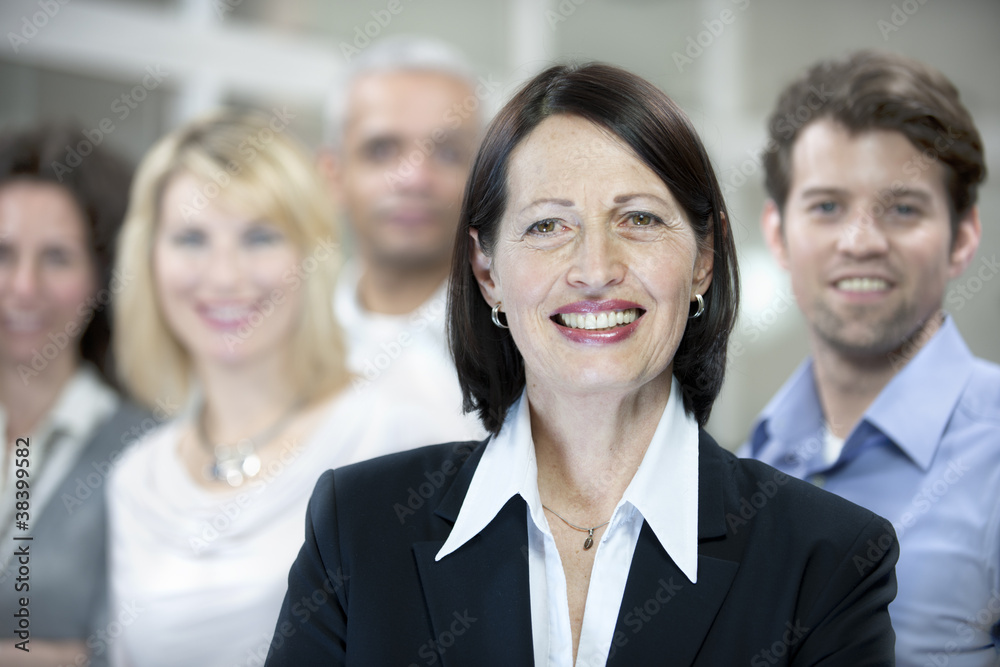 Portrait of a mature businesswoman and business team Portrait of a mature businesswoman and business team