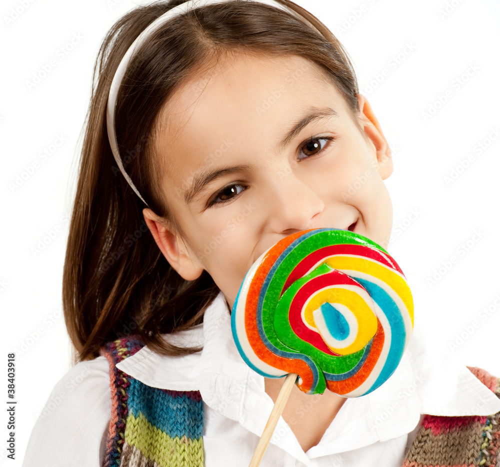 little girl with lollipop isolated on white