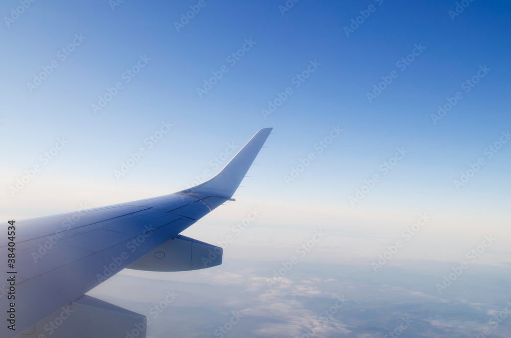Wing of airplane from window Wing of airplane from window
