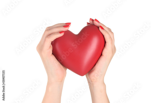 Red heart in woman s hands isolated on white