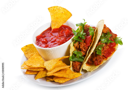 plate with taco, tortilla chips and tomato dip