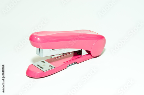 Pink stapler on a white background