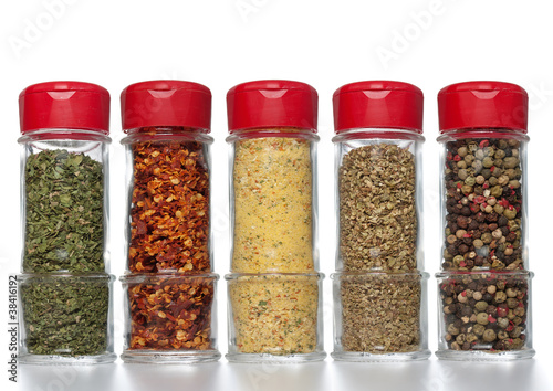 Fototapeta Naklejka Na Ścianę i Meble -  Various spices in small glass bottles