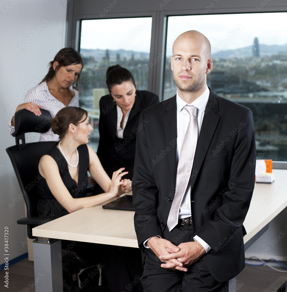 Portrait of a smart businessman with his team Portrait of a smart businessman with his team